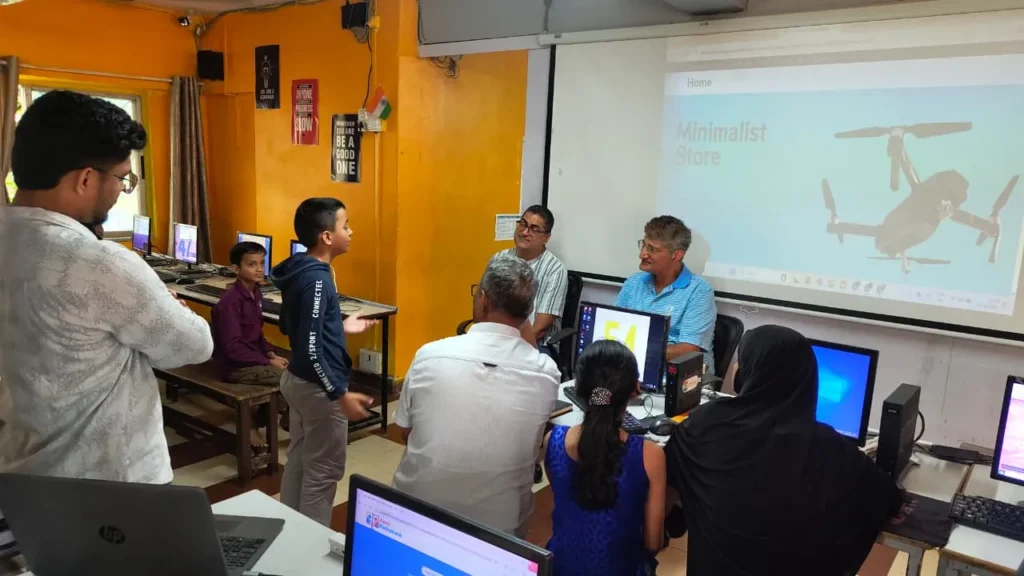 A student presenting his project to Dr. Aniruddha Malpani inside an Apni Pathshala Pod, showcasing active learning and communication skills.