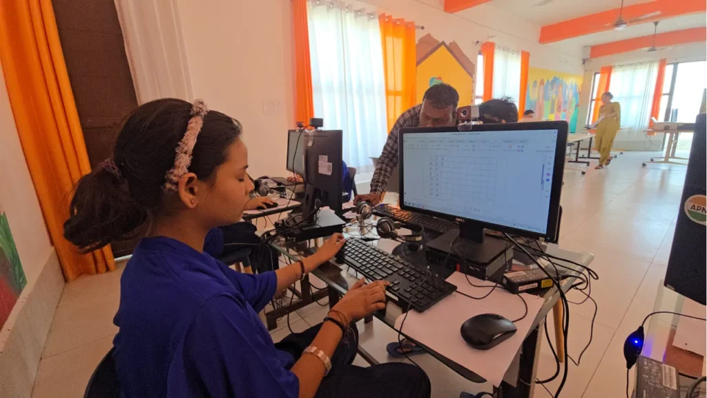 A student at an Apni Pathshala Learning Pod Working independently on a computer during a self-directed learning session.