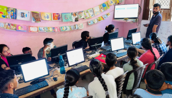 An educator teaching students in a community microschool in Haryana